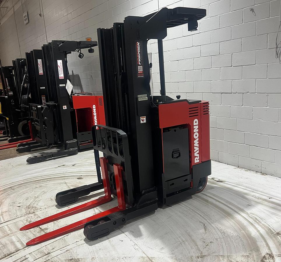 “Raymond 31I‑R45TT stand‑up reach truck front side angle – reach mast, forks, operator compartment, 36V electric warehouse forklift – Brampton ON”