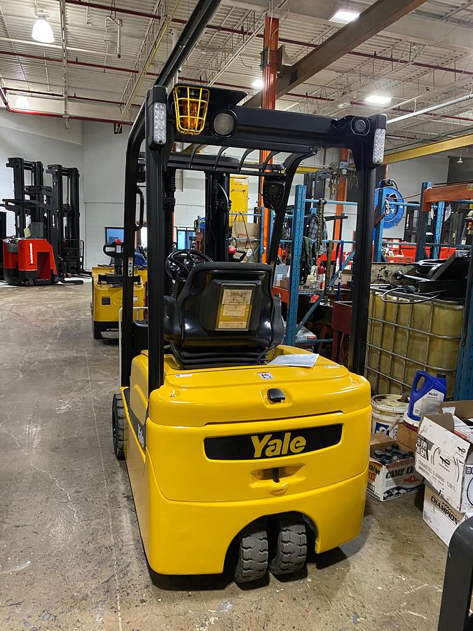 back angle showing solid pneumatic three wheel tires