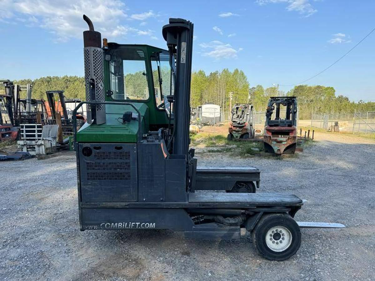 Side view of refurbished 2012 Combilift C10000XL LP Gas multi‑directional forklift showing fork positioner, 78" forks, 217" mast, and CSA certification decal during Ontario deployment.