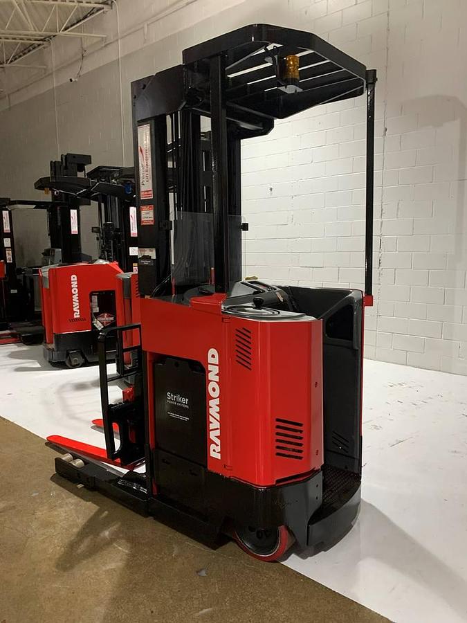 Refurbished 2015 Raymond ET-R30TT electric reach truck with CSA certification and new paint deployed in Mississauga for narrow aisle warehouse operations