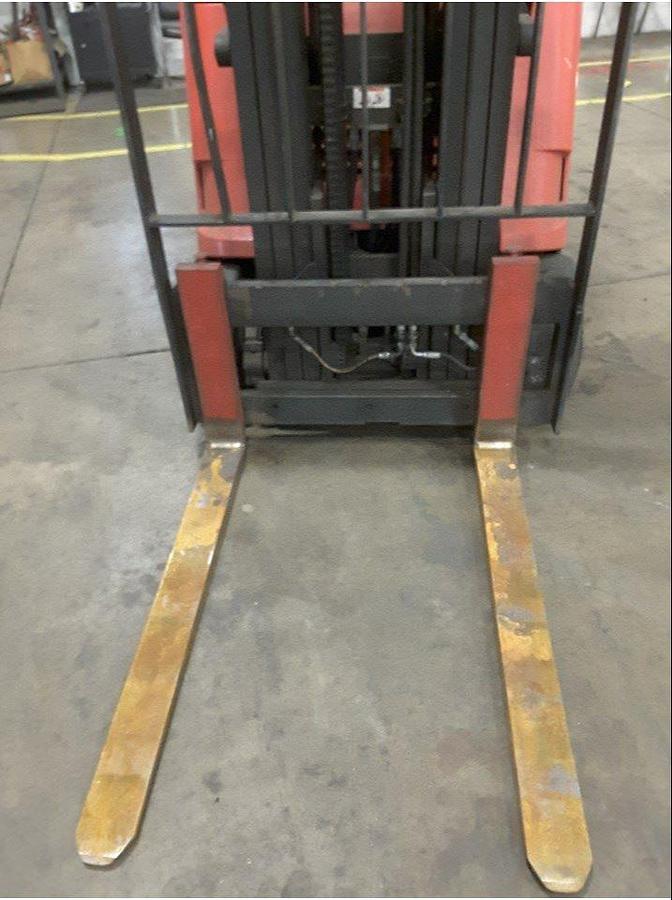 Close-up view of refurbished 2011 Raymond 425-C40TT electric dockstocker showing 42" forks, side shift carriage, and load backrest during Vaughan deployment