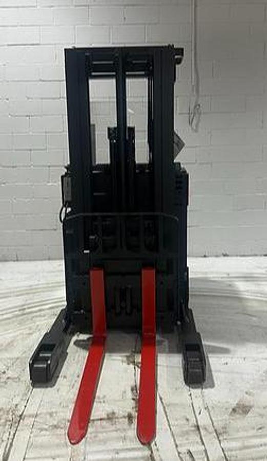 Front view of Raymond 31I‑R45TT Budget reach truck — mast, carriage, and poly tires visible.