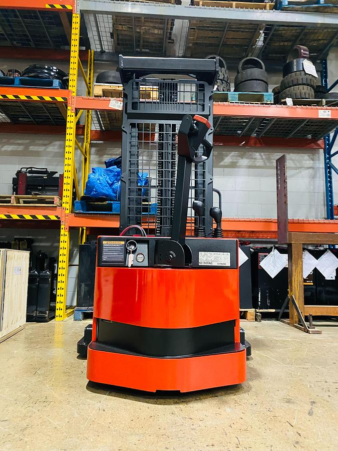 "Rear view of refurbished Raymond RSS walkie straddle stacker showing control handle and chassis"