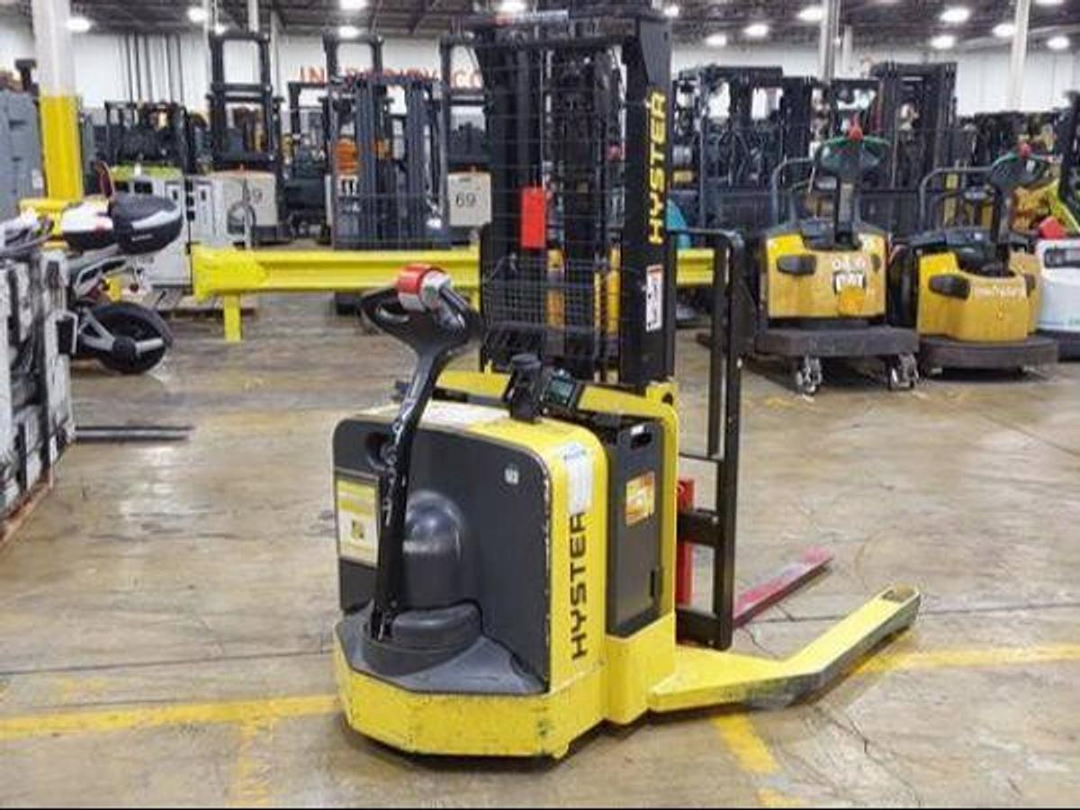 Rear side view of refurbished 2017 Hyster W30ZA2 electric walkie straddle stacker showing rear chassis, 24V battery compartment, and CSA certification decal during Ontario deployment.