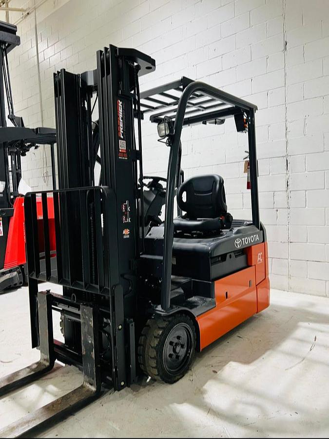 Front side view of refurbished 2023 Toyota 8FBE20U electric forklift showing 189" mast, side shift carriage, CSA decal, and non-marking cushion tires during Mississauga deployment