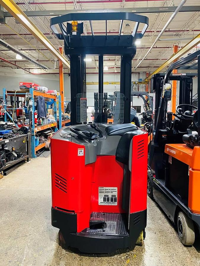 Operator compartment view showing stand-up controls and ergonomic handle