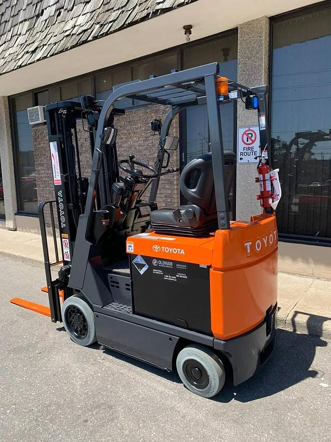 Opposite side view of Toyota 7FBCU15 showing compact chassis, cushion tires, and operator seat – CSA certified electric forklift for indoor use