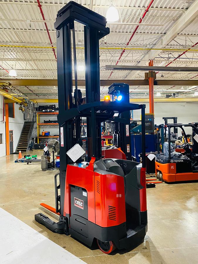 Rear angle side view showing counterweight and mounted safety lighting