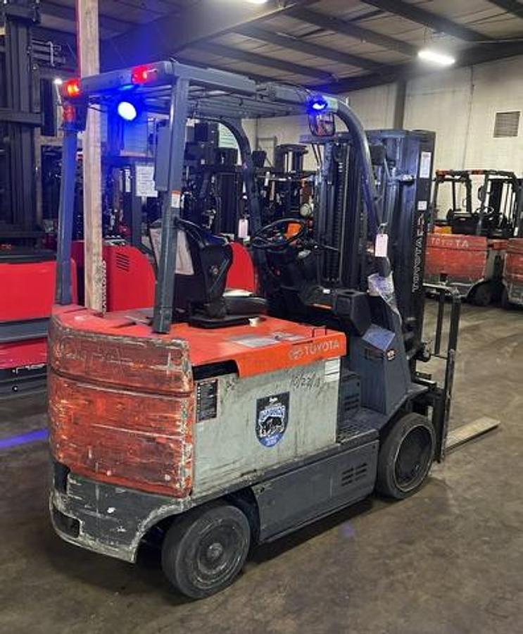 Rear side angle of 2019 Toyota 7FBCU35 electric forklift – CSA-certified 8,000 lb 4-wheel chassis with 187” triple mast, clamp-ready 4-way hydraulics, and cushion tires shown reconditioned with used 36V battery option available in Brampton ON – Premier Lift Equipment