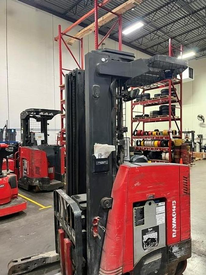 Opposite side view of 2020 Raymond 730‑R45TT single‑reach forklift with 200” mast, side‑shift, and narrow‑aisle chassis — refurbished and CSA‑certified