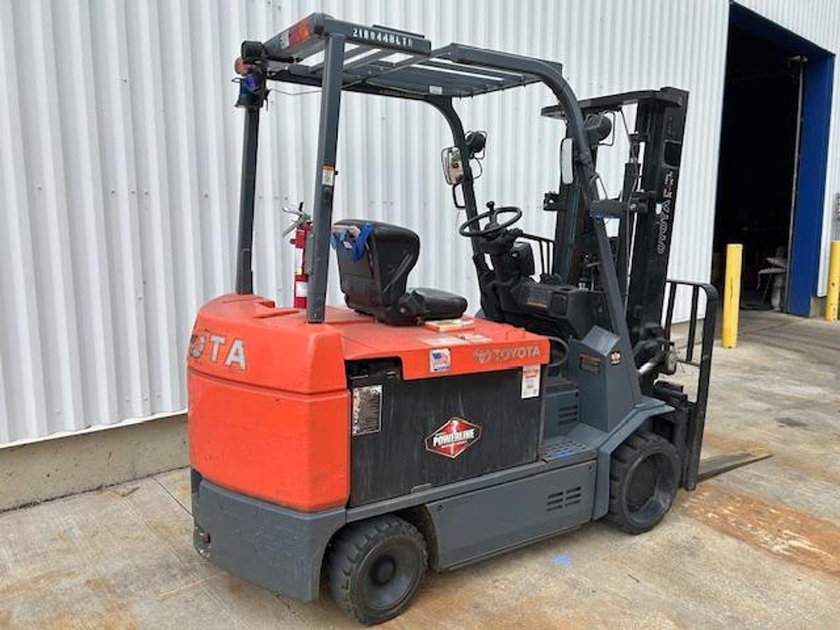 Opposite rear angle view of Toyota 7FBCU45 forklift – showing rear chassis, overhead guard, and traction steer tire – Premier Lift Equipment Brampton ON