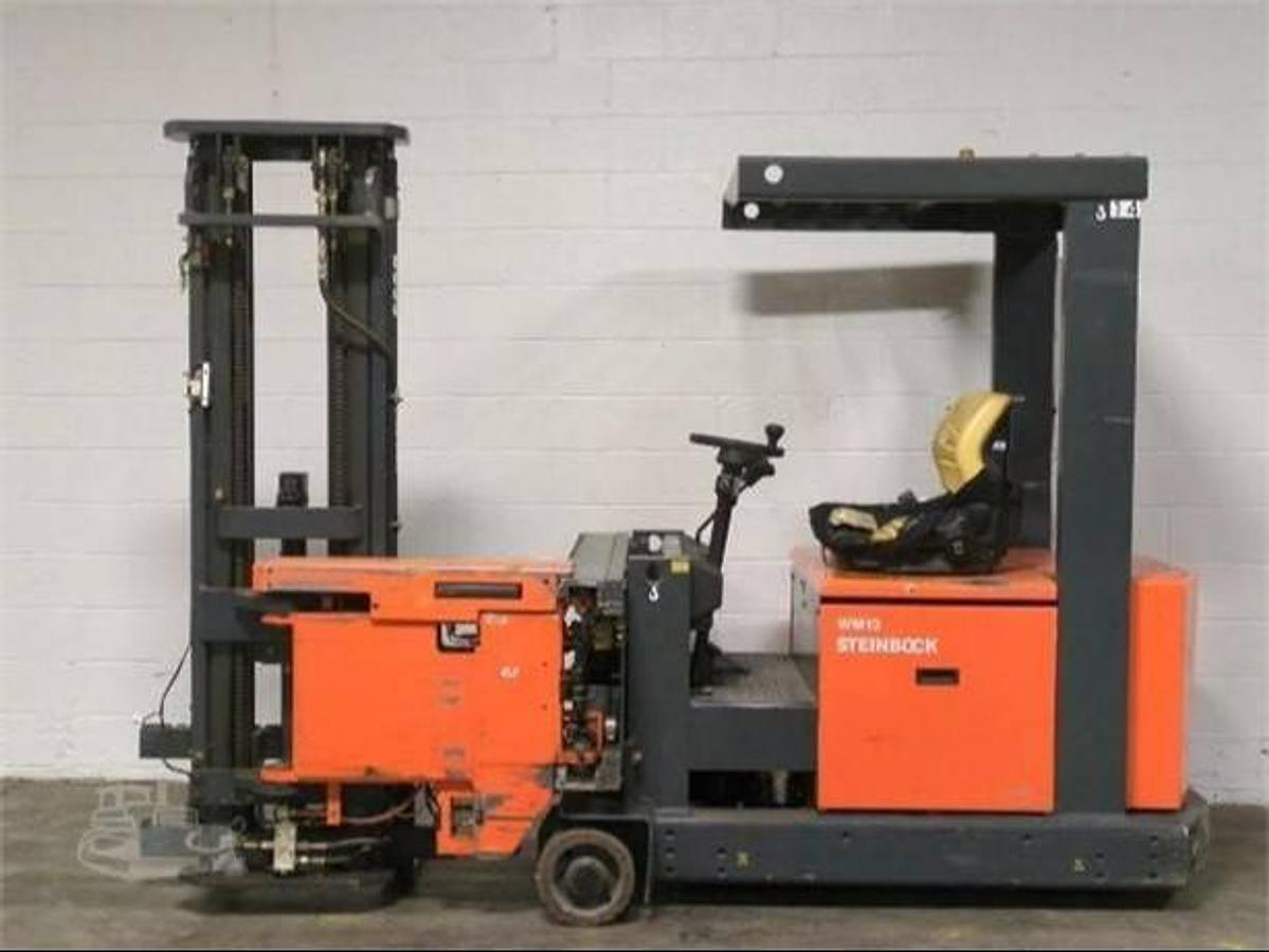 Opposite side view of refurbished 1999 Steinbock VM13 swing mast man‑down turret truck showing operator compartment, 2" forks, 48 volt chassis, 203" lift mast, and CSA certification decal during Brampton deployment.