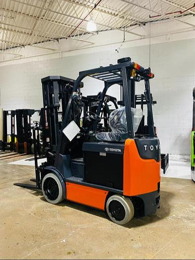Rear side angle of 2019 Toyota 8FBCU20 electric forklift – CSA-certified 4,000 lb chassis with overhead guard, rear counterweight, and cushion tires shown reconditioned with used battery option and new 48V battery upgrade available in Brampton ON – Premier Lift Equipment