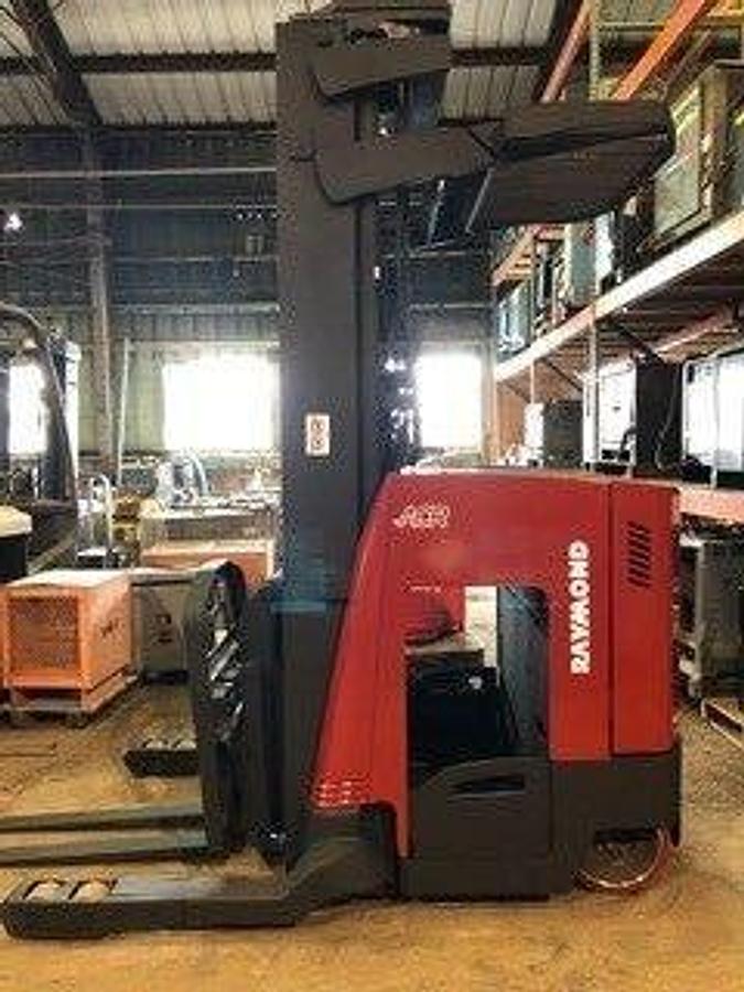 Side profile of Raymond 740DR32TT electric deep-reach forklift showing extended mast rails, reach mechanism, and chassis layout during Brampton deployment