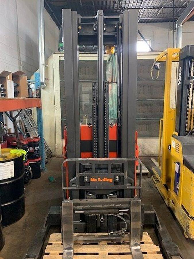 Front view of vintage 1992 Raymond 20IR40TT electric order picker showing mast, forks, platform, and reach carriage during Concord deployment