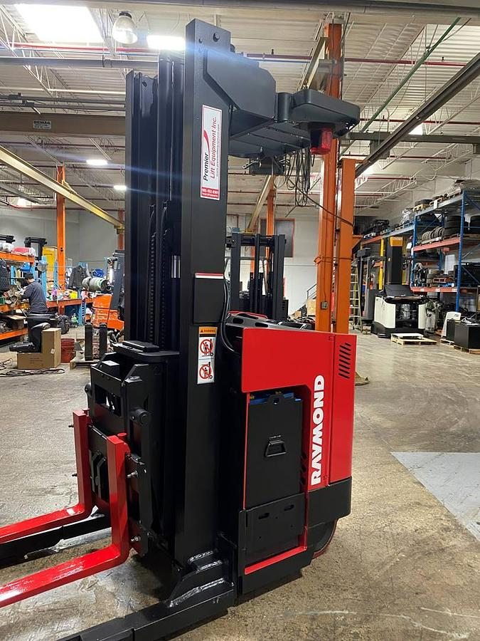 Refurbished 2013 Raymond EZR30TT electric reach truck with CSA certification and new paint deployed in Mississauga for narrow aisle warehouse operations