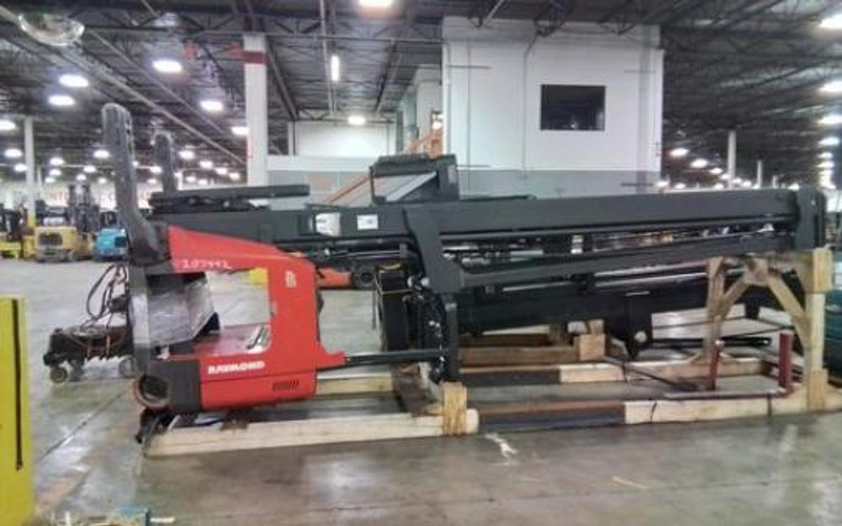  Opposite Cradled and Laid Down Side view of CSA-certified Raymond 753-R45TT electric reach truck with triple mast – staged in Brampton ON