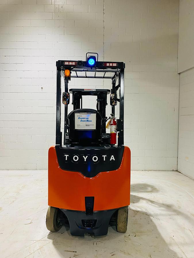 Rear counterweight of Toyota 8FBCU20 COM electric sit-down forklift showing branded counterweight, rear lights, and CSA-certified chassis – unit staged in Brampton ON