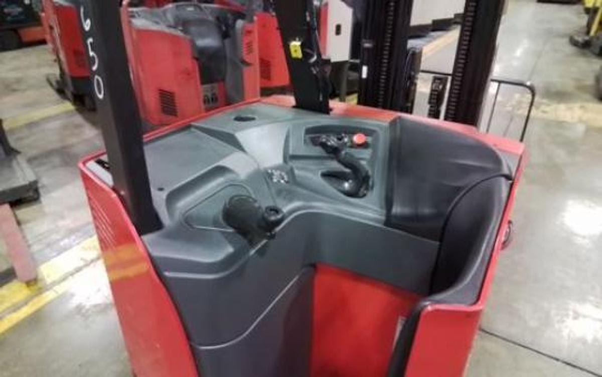 Operator compartment view of Raymond 425-C35TT electric stand-up counterbalance forklift – CSA-certified 3,500 lb chassis showing ergonomic controls, deadman pedal, and side-stance platform staged in Brampton ON – Premier Lift Equipment