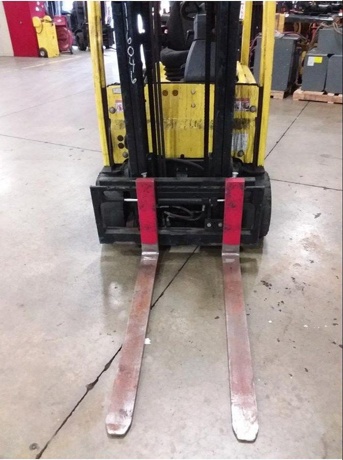 Front view of refurbished 2012 Hyster J40XNT 3‑wheel electric forklift showing truckers mast, 42" forks, side shift, cushion tires, and CSA certification decal during Ontario deployment.