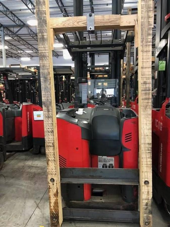 Rear side angle of Raymond 750DR32TT deep-reach forklift showing counterweight, rear wheels, and CSA certification during warehouse deployment