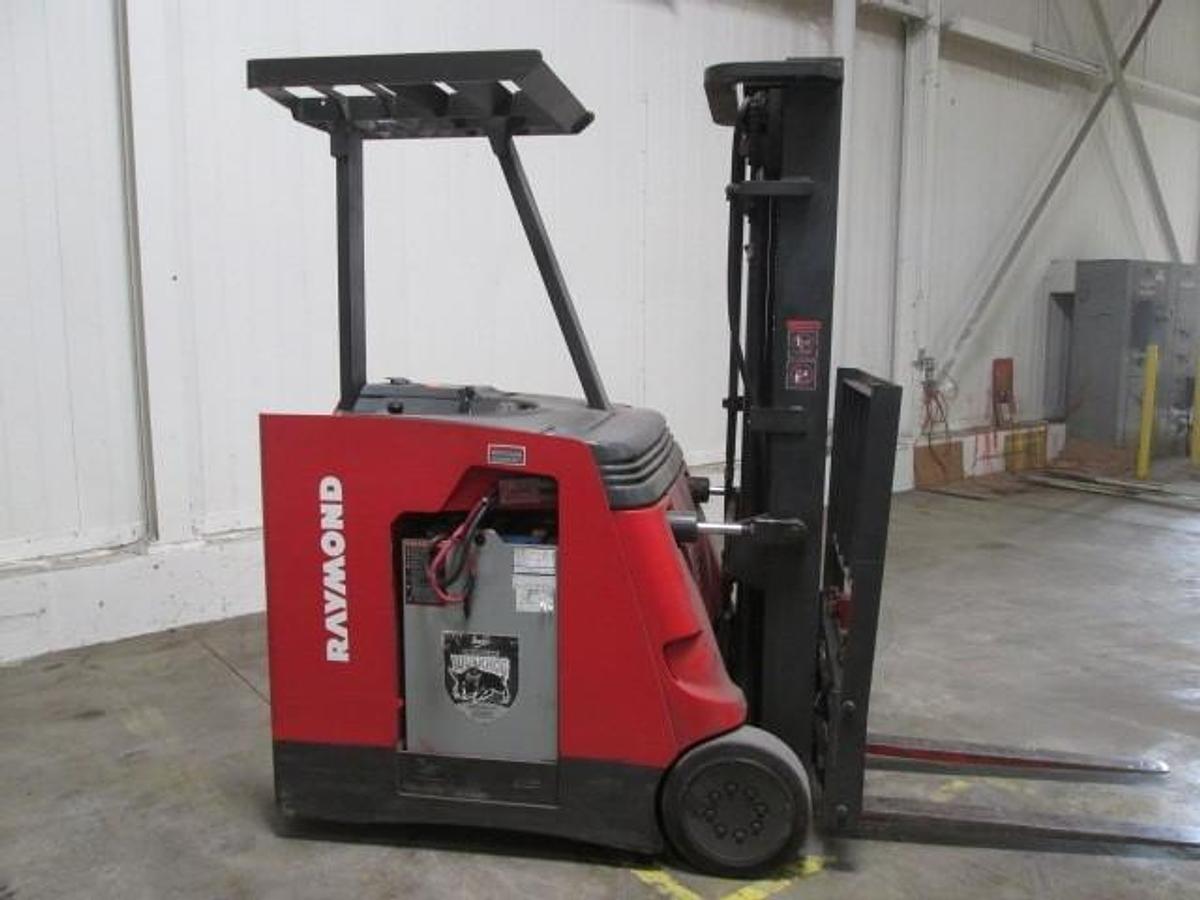 Side view of refurbished 2008 Raymond 420-C40TT electric docker showing battery compartment, chassis frame, and side shift carriage during Mississauga deployment