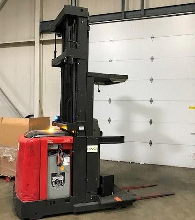 Side view of refurbished 2007 Raymond 540-OPC30TT electric order picker showing battery compartment, chassis frame, and platform base during Brampton deployment