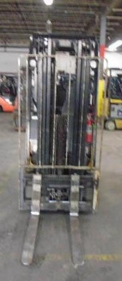 Front view of refurbished 2011 Yale ERC030VAN electric forklift showing mast, carriage, and cushion tires during Brampton deployment