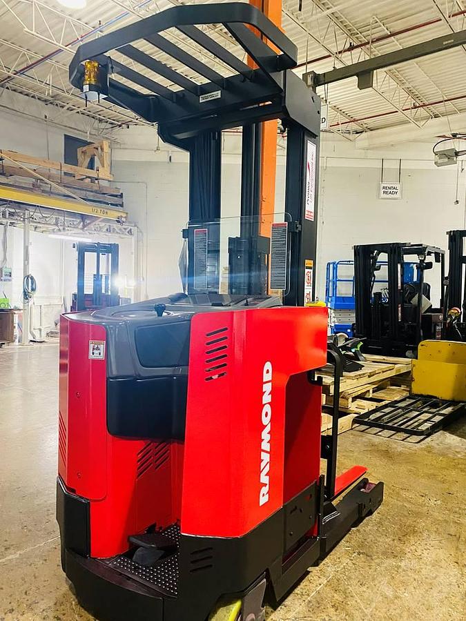 Refurbished 2003 Raymond ET-30RTT electric reach truck with CSA certification and new paint deployed in Mississauga for narrow aisle warehouse operations