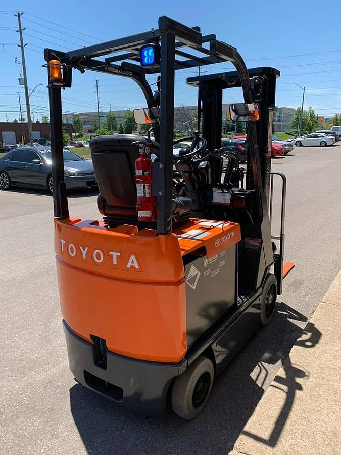 Rear side corner view of Toyota 7FBCU15 electric forklift showing compact chassis, EE-rated labeling, and cushion tires – CSA certified indoor unit in Brampton ON