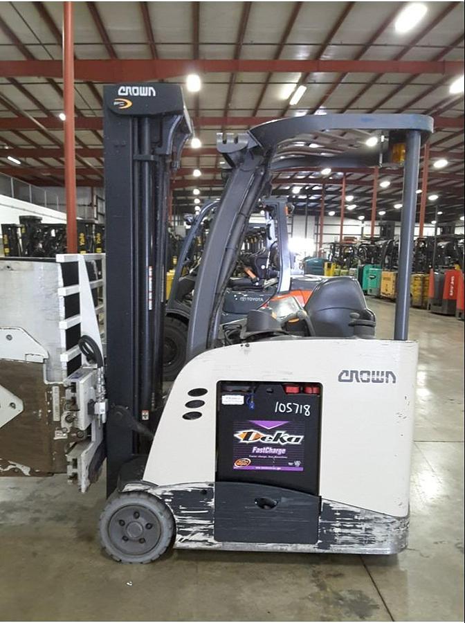 Opposite side view of refurbished 2013 Crown RC5545‑40 electric forklift showing operator compartment, 4‑way hydraulics, 36 volt battery compartment, and CSA certification decal during Ontario deployment.