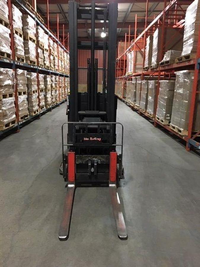 Front view of refurbished 2007 Raymond EASIDR25TT electric double reach forklift showing fork carriage, reach mechanism, and mast rails during Ontario deployment