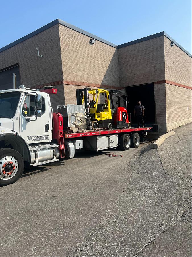 forklift pickup on flatbed truck, Premier Lift service logistics, GTA dispatch