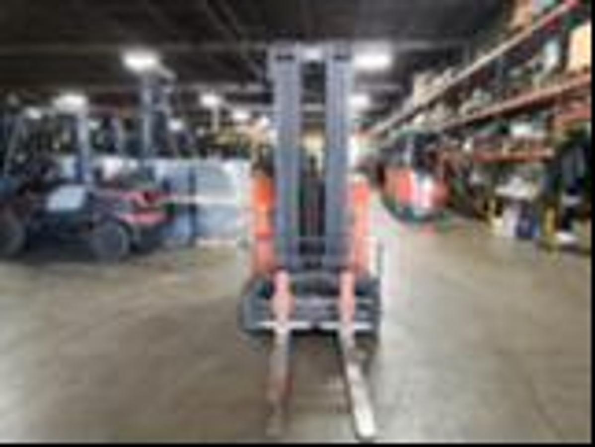 Front view of refurbished 2017 Toyota 8FBNCU20 electric counterbalance forklift showing fork carriage, SS/FP mechanism, and mast rails during Ontario deployment
