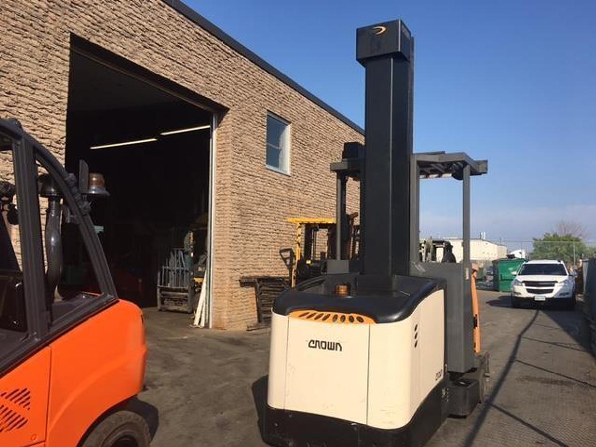 2012 Crown TSP6000-30 electric turret truck with articulating mast and narrow chassis deployed in Etobicoke for CSA-compliant high-reach warehouse operations