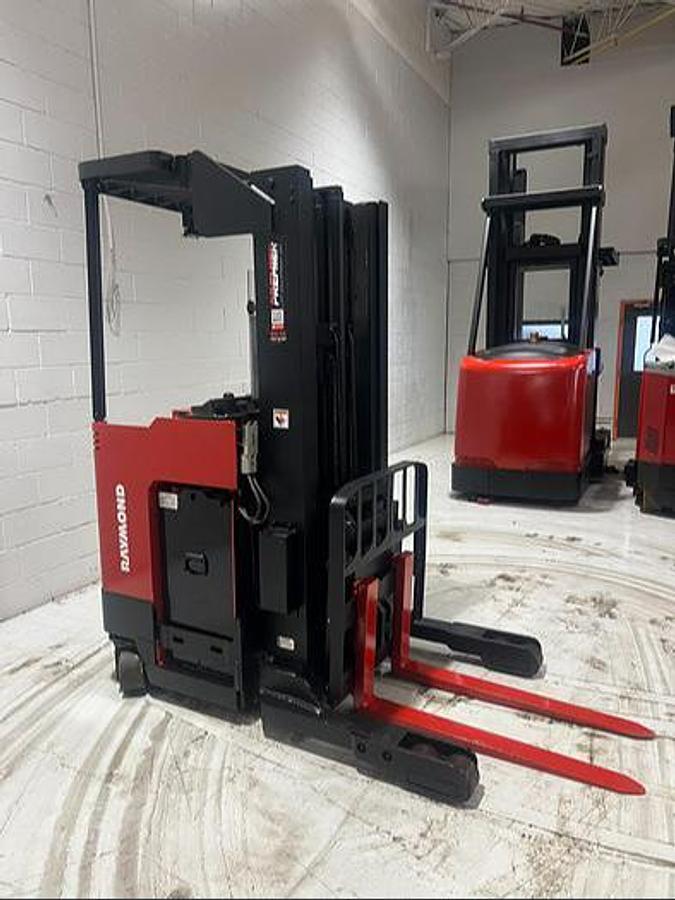 Budget Raymond 31I‑R45TT stand‑up reach truck — 4,500 lb capacity, 180” triple mast, 36V electric, single‑reach carriage, indoor warehouse unit.