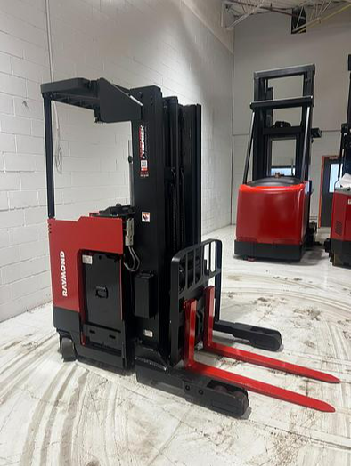 Budget Raymond 31I‑R45TT stand‑up reach truck — 4,500 lb capacity, 180” triple mast, 36V electric, single‑reach carriage, indoor warehouse unit.