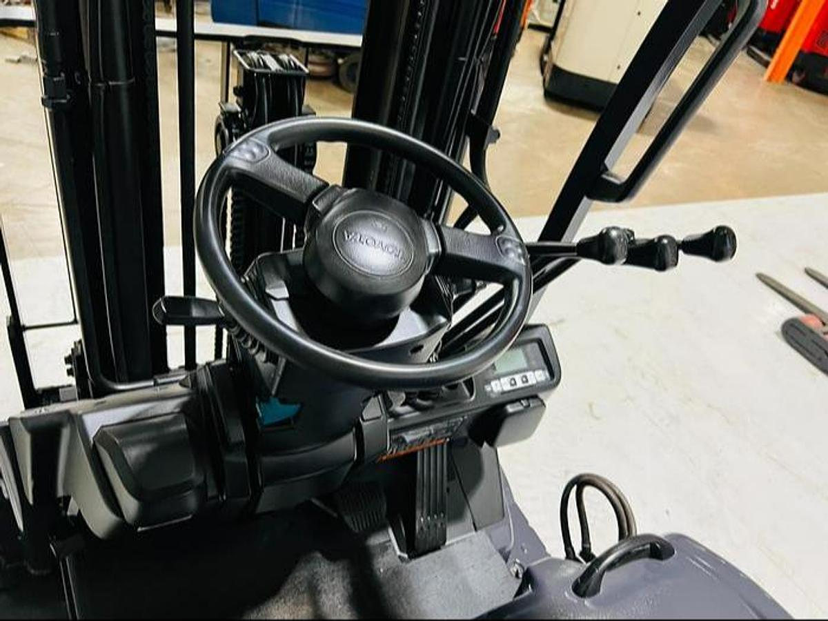 Steering wheel of refurbished 2023 Toyota 8FBE20U electric forklift showing SAS controls and ergonomic grip during Mississauga deployment