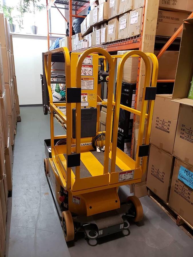 Operator platform view showing safety rails and CSA labeling