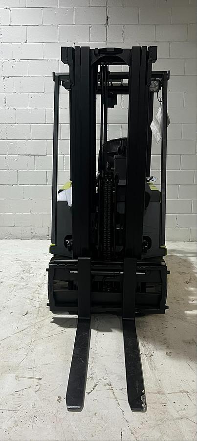 Front view of Budget Clark TM20 older 3‑wheel electric forklift, non‑CSA, includes used battery and charger.