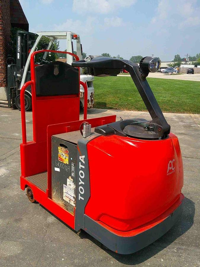 Rear angle view of Toyota 8TB50 tugger – showing stand-on operator deck, rear chassis, CSA inspection tag, and indoor tread tires – Premier Lift Equipment Brampton ON