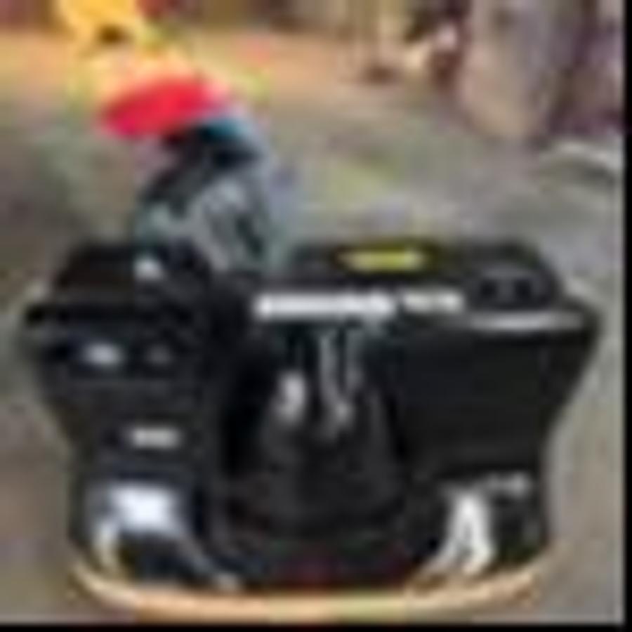 Operator handle and control dash of refurbished 2014 Big Joe WPT45 electric walkie pallet jack showing steering handle, electric controls, battery charger port, and CSA certification decal during Ontario deployment.