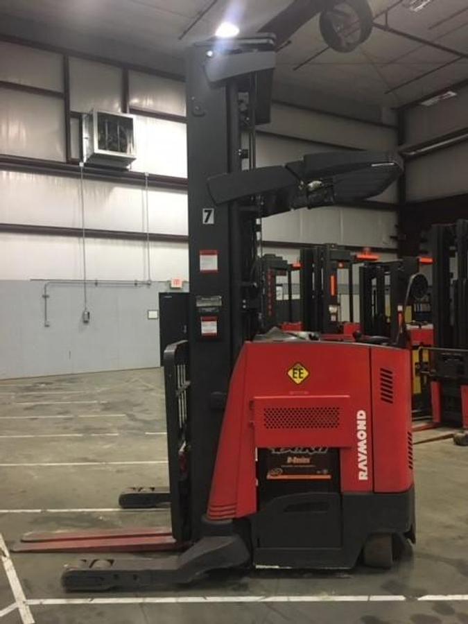 Opposite side view of refurbished 2011 Raymond 740-R45TT EE-rated electric reach truck showing reach mechanism, drive unit cover, and chassis structure during Concord deployment