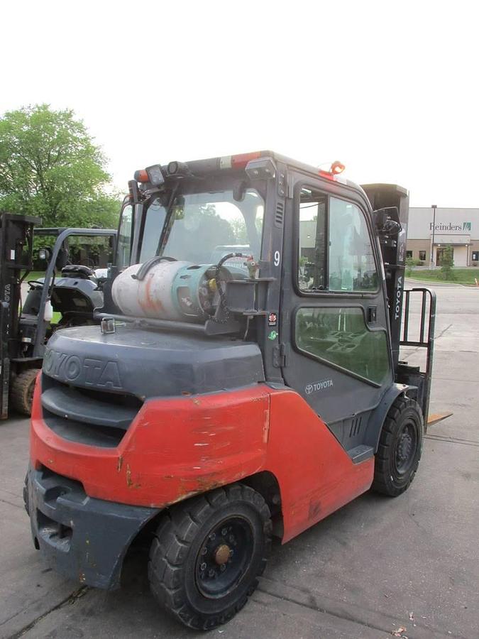Angled back side view of Toyota 8FG35U propane pneumatic forklift showing rear counterweight, cab enclosure, and CSA-certified frame – unit staged in Brampton ON