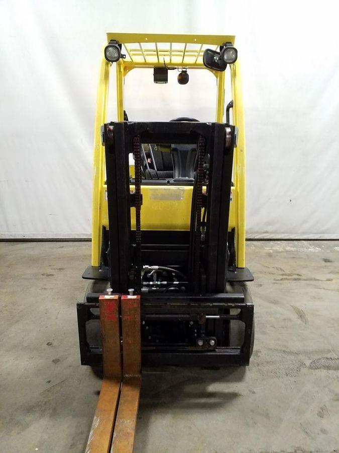 Front view of refurbished 2014 Hyster S40FT LP Gas forklift showing 42" forks, truckers mast with side shift, headlights, solid black tires, and CSA certification decal during Ontario deployment.