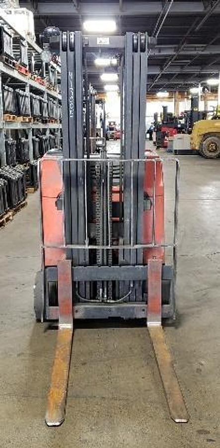 Front angle of Toyota 8BNCU20 showing mast, forks, and operator compartment