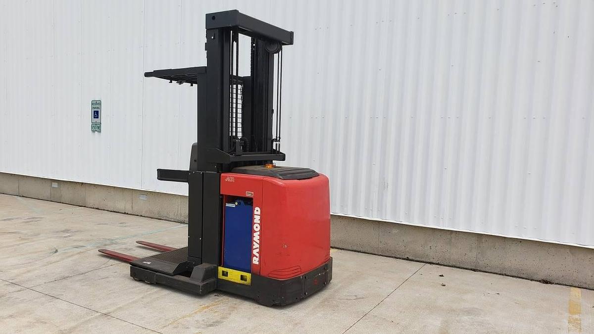 Side view of refurbished 2013 Raymond 550-OPC30TT electric order picker showing battery compartment, chassis frame, and platform base during Mississauga deployment