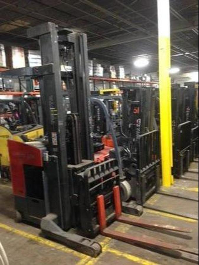 Opposite side view of refurbished 2007 Toyota 7BDRU15 electric double reach forklift showing 36V battery box, hydraulic lines, and CSA decal during Ontario deployment