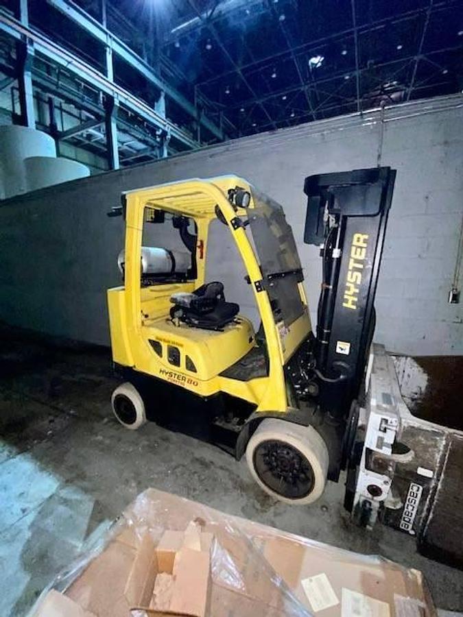 Side profile of 2006 Hyster S80FTBCS LPG cushion forklift showing mast rails, short frame chassis, and cushion tires during Brampton deployment