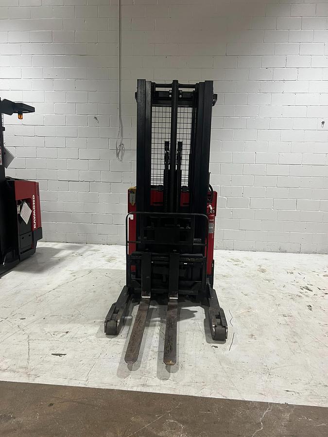 Front view of Raymond EASIR40TT Budget reach truck — mast, carriage, and poly tires